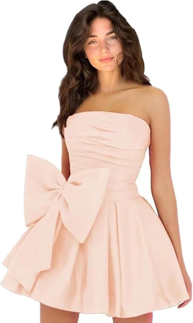 Effortlessly chic and stylish, our Short A-line Homecoming Dresses are perfect for any special occasion. Featuring a sleeveless, strapless design with ruching and a delicate lace up back, this dress is both elegant and comfortable. Complete with a charming bow, this dress will make you stand out in any crowd. A-line Strapless Dress For Prom Party, Feminine A-line Strapless Evening Dress, Solid Sleeveless Dress For Prom, Flirty A-line Strapless Cocktail Dress, A-line Mini Dress With Pleated Bodice For Prom, Pleated Bodice A-line Mini Dress For Prom, Summer Homecoming Mini Dress With Ruched Bodice, Elegant Strapless Dress For Homecoming, Elegant Bandeau Mini Dress With Ruched Bodice