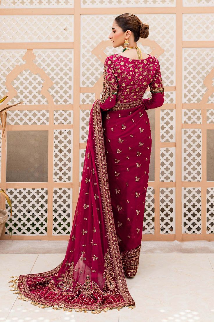 Embellished Bridal Wedding Dress in Red Saree Style is a breathtaking attire that is perfectly stitched. Lavish quality of the fabric and premium designs make this Bridal Dress an epitome of beauty and your foremost priority to have a head-turning look on the big day. Embellished Blouse: The beautiful blouse in premium raw silk fabric is perfectly stitched and it gives the Saree Dress a traditional look. Hand-crafted details of dabka, sequins, and kundan give a traditional touch to this blouse. Red Gown For Eid And Traditional Ceremonies, Red Wedding Dress For Eid, Red Dress For Wedding And Eid Celebration, Red Saree Dress For Traditional Ceremonies, Red Gown With Resham Embroidery For Eid, Formal Red Lehenga With Intricate Embroidery, Anarkali Dress For Traditional Ceremonies, Formal Red Georgette Salwar Kameez, Red Georgette Salwar Kameez For Formal Occasions