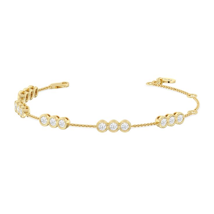 Round out your everyday style with the sparkle of this diamond bracelet. You can wear it on its own or stack it with a timepiece or a couple of bangles. This bracelet is designed to withstand frequent use. It features a series of diamond trios set securely on bezels. The bezel setting ensures the diamond stays firmly in place and its sides are protected from impact. Timeless Stackable Cubic Zirconia Diamond Bracelet, Timeless Stackable Diamond Bracelet, Stackable Diamond Bracelet, Timeless Stackable Diamond Tennis Bracelet, Timeless Diamond Stackable Tennis Bracelet, Timeless Diamond Tennis Bracelet Stackable, Timeless Stackable Diamond Bracelets, Timeless Stackable Diamond Bracelet With Adjustable Fit, Timeless Adjustable Stackable Diamond Bracelet