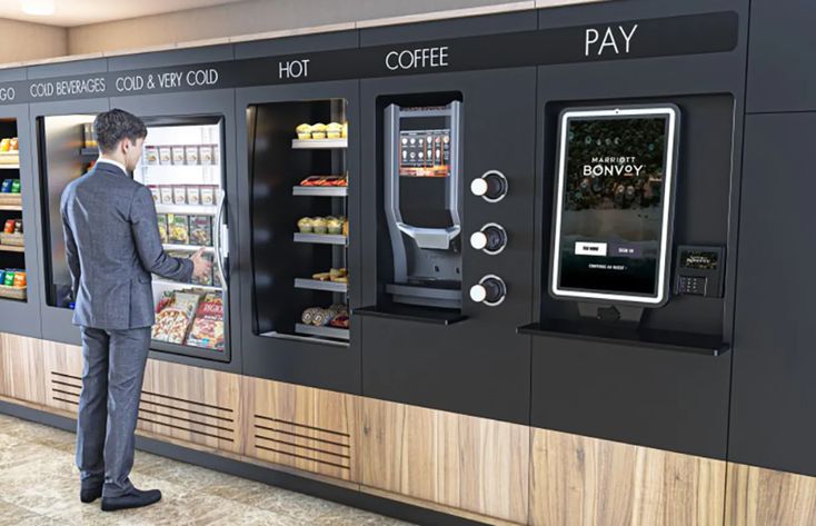 a man standing in front of a vending machine