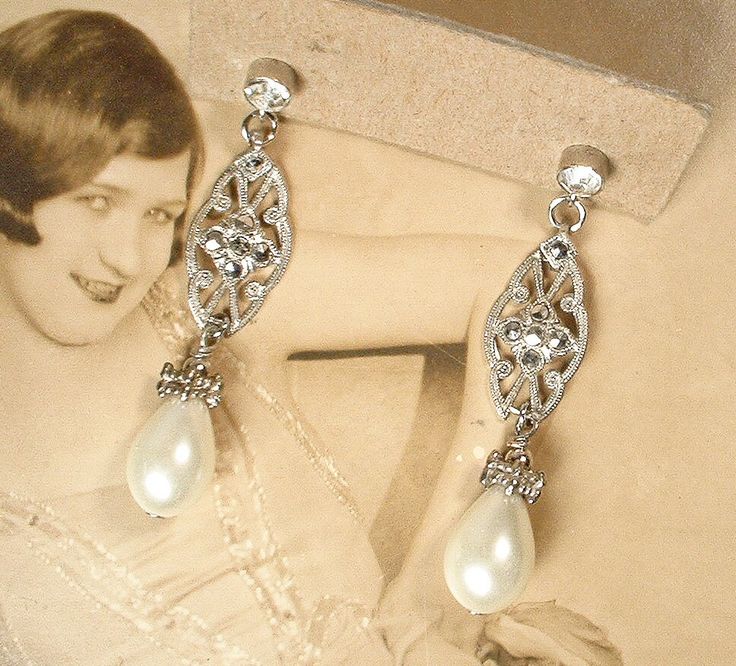 Offering a STUNNING pair of Art Deco/Art Nouveau genuine marcasite, glass ivory pearl and clear crystal rhinestone Flapper sterling silver earrings made from original 1930s era bracelet links.  These will be as gorgeous with a pair of jeans and tee as they will with a Bridal gown!  I absolutely adore the elegant design of these; they look like they are right off the set of Downton Abbey!  The ornate open work solid sterling silver links are encrusted with SO sparkly genuine marcasites.  From the Elegant Vintage Charm Earrings For Wedding, Elegant Vintage Charm Wedding Earrings, Vintage Dangle Bridal Earrings For Anniversary, Vintage Charm Earrings For Wedding, Vintage Bridal Earrings With Intricate Design, Vintage Bridal Earrings With Intricate Design For Formal Occasions, Vintage Teardrop Bridal Earrings For Wedding, Classic Vintage Charm Jewelry For Wedding, Vintage Dangle Bridal Earrings