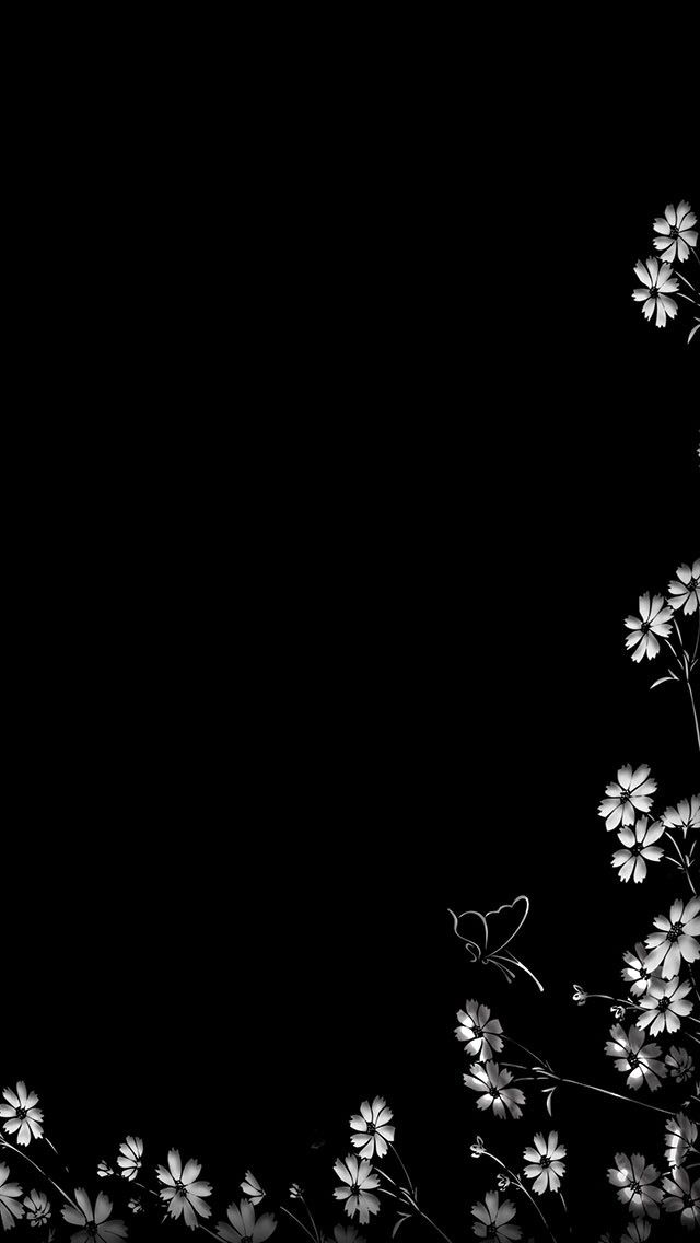 black and white photograph of flowers against a dark background