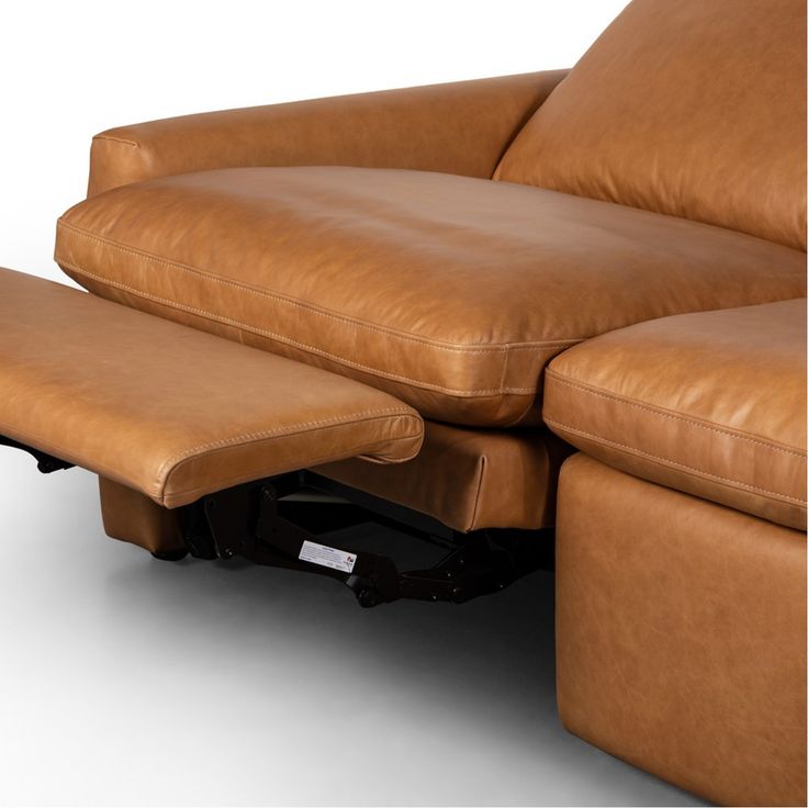 a brown leather reclining chair and ottoman