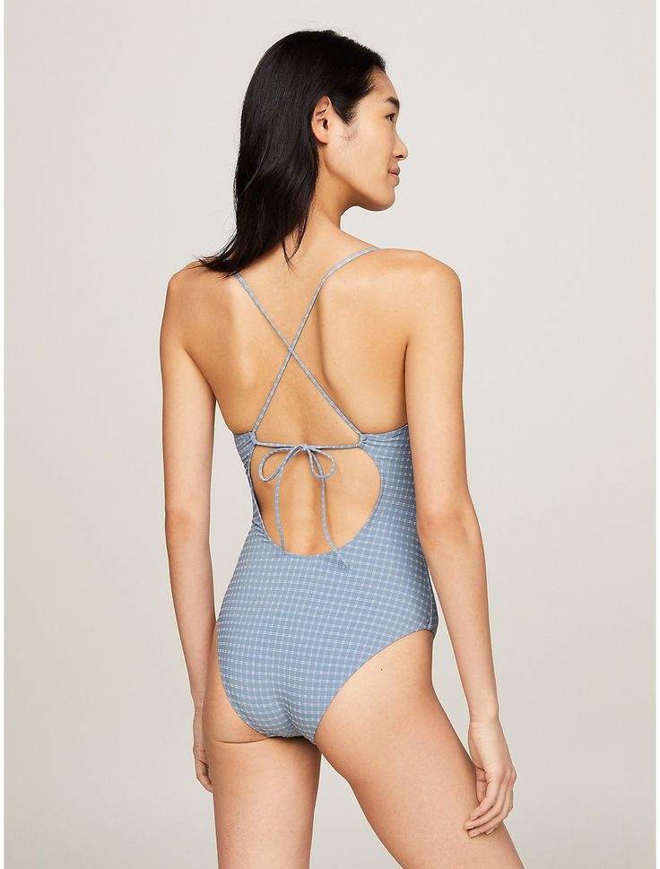 Tommy Hilfiger women's swimwear. This retro-check print one-piece swimsuit features a self-tie straps, a center cut-out, and a low-cut back.  Material: 72% Recycled Nylon ,  Polyamide, 17% Polyesther Pes. Gingham Swimwear With Adjustable Straps For Poolside, Poolside Gingham Swimwear With Adjustable Straps, Tommy Hilfiger Swimwear For Spring Beachwear, Tommy Hilfiger Beachwear For Spring, Tommy Hilfiger Spring Beachwear, Spring Gingham One-piece Swimwear, Tommy Hilfiger Beachwear, Vacation Gingham Swimwear With Adjustable Straps, One-piece Gingham Swimwear For Summer