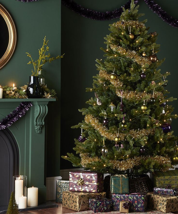 a decorated christmas tree in front of a fireplace