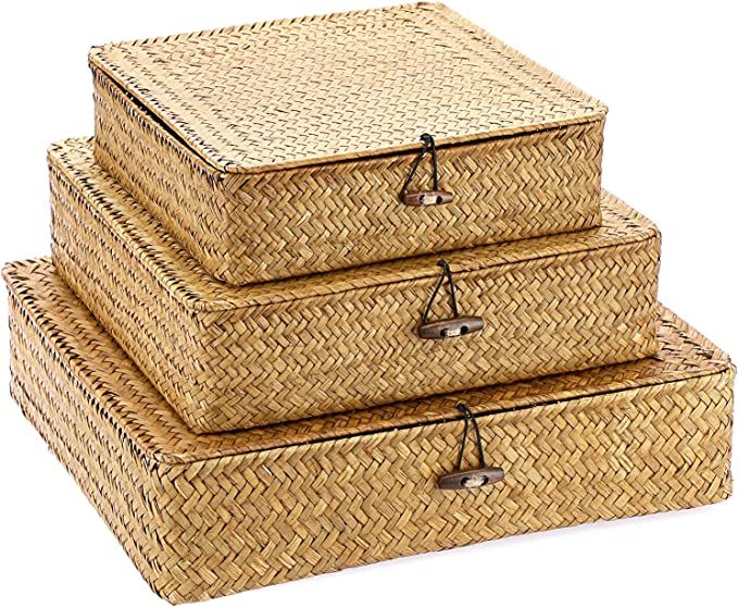 three woven storage baskets stacked on top of each other, one with handles and the other without handles