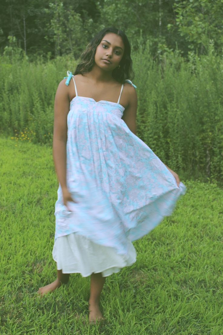 This dress is a boho dream. Embrace the slow craft of our nature inspired handblock printed hemp and bamboo dress, dyed with organic love. The organic cotton lining of the dress adds to flow and gives a ruffled accent around the edges of the dress and pockets. The print is created using organic dyes and hand carved wooden blocks by the artisans of Jaipur, India. The garment is sewn by women of Sewing the Seeds social enterprise. Hand crafted in India Relaxed Cotton Dress For Garden Party, Relaxed Fit Cotton Dress For Garden Party, Breezy Cotton Daywear Dresses, Breezy Cotton Flowy Sundress, Breezy Cotton Day Dresses, Breezy Cotton Sundress With Flowy Fit, Flowy Cotton Breezy Sundress, Spring Flowy Dresses With Natural Dye, Cotton Smock Sundress Midi Dress