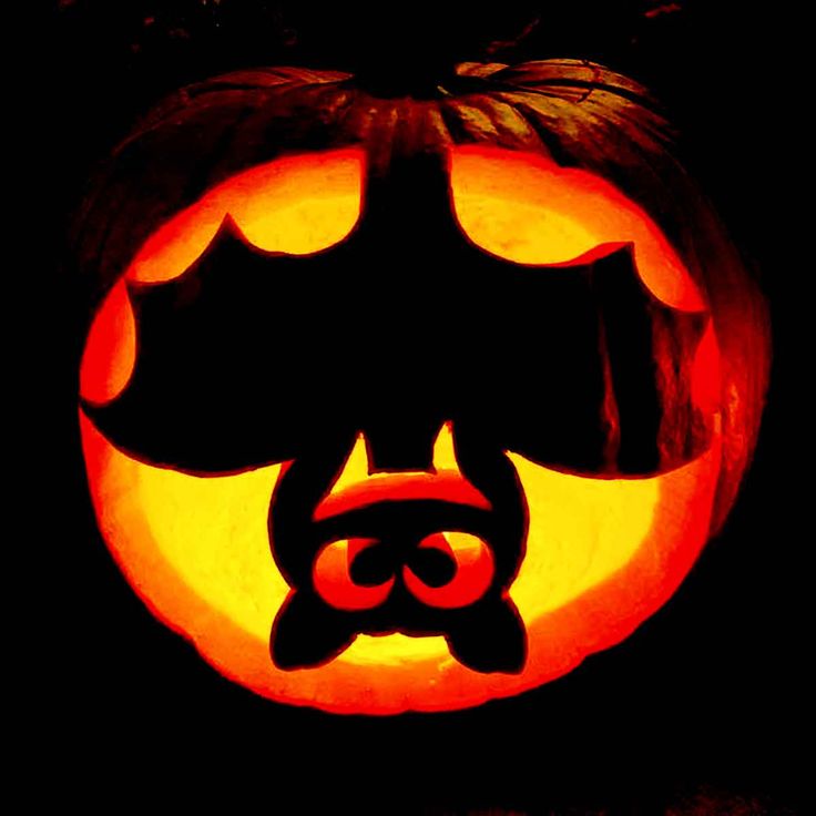 a bat pumpkin carved into the shape of a face