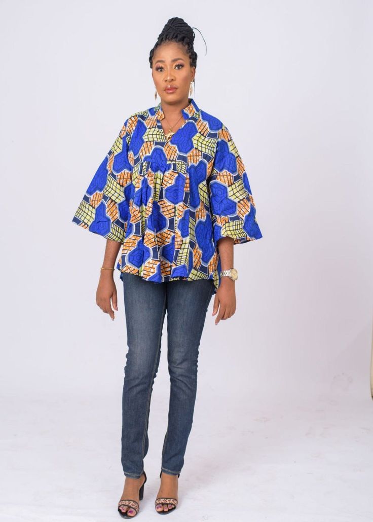 Fierce and feminine , this Ankara top has a unique in a relaxed, easy fit, oversize fit.You'll love how well it pairs with jeans and leggings bringing the high fashion drama you crave. V-neclline Short flared sleeves Cool iron as needed Pullover style Split-neck tunic Ankara Tops For Women, Ankara Plus Size, Ankara Tops, Women Blouse, Flared Sleeves, Traditional Outfits, Oversized Fits, Ankara, Pullover Styling