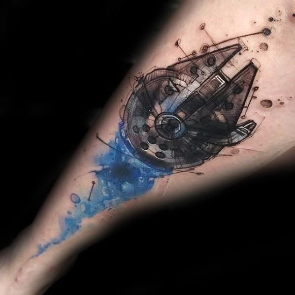 a man's leg with a watercolor tattoo on it that has a spaceship in the center