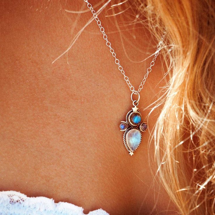 This mystical and celestial necklace will add a touch of magic to your look! Made with Labradorite and Moonstone gems, this sterling silver necklace features crescent moons and stars inspired by the cosmos. Labradorite can symbolize self-love, spiritual protection and intuition. As well, Moonstone can symbolize the divine feminine, clarity, intuition and the moon phases. *Our jewelry features natural, genuine gemstones, ensuring each piece is unique and one-of-a-kind. Please note that, as no two Bohemian Moonstone Birthstone Necklace, Bohemian Moon Phase Necklace In Sterling Silver, Bohemian Sterling Silver Moon Phase Necklace, Labradorite Moon Charm Jewelry For Healing, Spiritual Sterling Silver Moon Phase Necklace, Bohemian Sterling Silver Moon Phase Jewelry, Celestial Gemstone Sterling Silver Necklace, Celestial Style Gemstone Sterling Silver Necklace, Celestial Silver Labradorite Necklace