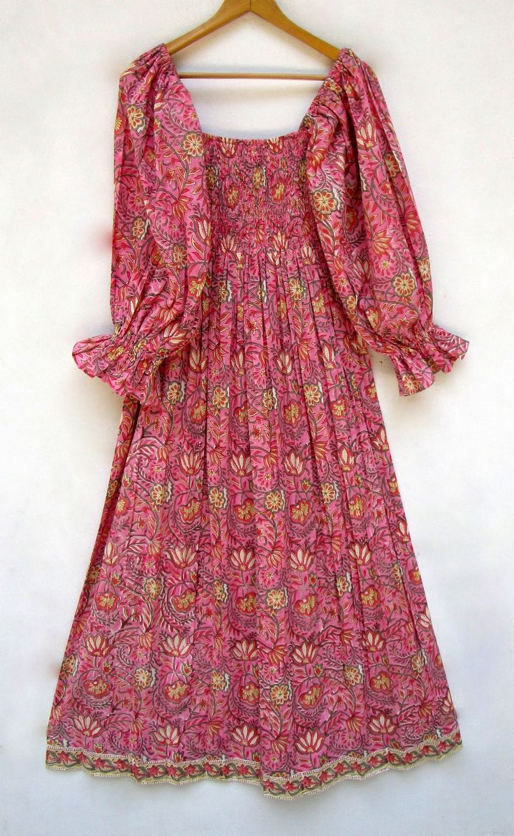 "ITEM DESCRIPTION pink lily's trendy flower printed cotton long maxi dress - square neckline with smocked boho maxi dress - long sleeve maxi dress Features: Long sleeve, square neck, Long dress Material: Cotton cambric Fabric: 100% cotton soft light weight ethnic print fabrics  Sleeve Length = 22 inch For more sizes & their measurement, please refer our below chart to understand the sizes variations available with us For your size requirement, please mention your size in seller note at the time of buying. SIZE MEASUREMENT  BUSTLENGTHSHOULDER XXS34 inch51 inch13.5 inch XS36 inch51 inch14 inch S38 inch51 inch14.5 inch M40 inch51 inch15 inch L42 inch51 inch16 inch XL44 inch51 inch16.5 inch 2XL46 inch51 inch17 inch 3XL48 inch51 inch18 inch   Company Return Policy:  Please write for more inform Summer Maxi Dress With Gathered Bishop Sleeves, Bohemian Long Sleeve Smocked Dress For Vacation, Pink Summer Maxi Dress With Gathered Sleeves, Pink Maxi Dress With Gathered Sleeves For Summer, Bohemian Peasant Dress With Gathered Sleeves, Bohemian Flowy Maxi Dress With Smocked Cuffs, Flowy Bohemian Maxi Dress With Smocked Cuffs, Pink Bohemian Dress With Gathered Sleeves, Bohemian Cotton Dress With Smocked Cuffs