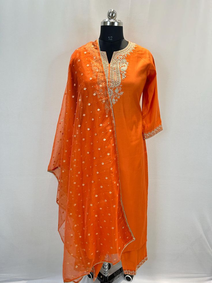 Orange Zari Embroidered Kurta with Trousers & Dupatta For Indian Party Wear Pakistani Salwar Kameez / Indian Wedding Dress / Plus Size Cotton Dress Traditional Indian Wear / Salwar Kameez Dupatta / Kurti Palazzo Set The set contains: 1 Straight Kurta 1 Palazzo  1 Dupatta Kurta: The orange embroidered Kurta has a round neck design. The Kurta measures till calf length and has straight hemline. Sleeve length :  3/4 Sleeves Palazzo :  Orange trousers has elasticated waistband and slip on closure . Dupatta: Dupatta comes with embroidered pattern as well. Material : Kurta :  Silk Blend Palazzo : Silk Blend Dupatta : Net Fabric Care : Hand wash Please see the size information below to choose a perfect size for yourself:  (size in inches)  XS : BUST 34 | WAIST 30 | HIPS 38 S : BUST 36 | WAIST 32 | Long Semi-stitched Embroidered Salwar Kameez, Long Embroidered Salwar Kameez For Diwali, Fitted Anarkali With Embroidered Border, Diwali Embroidered Long Salwar Kameez, Long Sleeve Sharara With Embroidered Border For Festivals, Fitted Sharara With Embroidered Border For Eid, Embroidered Long Churidar For Festive Season, Festival Long Sleeve Sharara With Embroidered Border, Summer Semi-stitched Embroidered Dresses