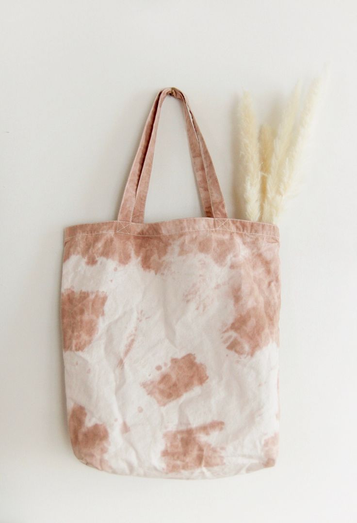 "+ This neutral tie-dyed tote bag is  perfect for everyday errands & adventures. + Bring it to the grocery store, farmer's market, library, beach, park, or keep it at home for general storage. + The beautiful beige tones match a variety of outfits. + Due to the production process, the tie dye design of the bag you receive may vary the listing photos. Each bag is one of a kind. + Cross-stitched straps ensure durability when the tote is in use. + This tote can hold over 30 pounds. + A boxed bottom Neutral Tie Dye, Tie Dye Tote Bag, Tie Dye Bags, Diy Tie Dye Shirts, Bow Hanger, Tie Dye Crafts, Diy Tie, Plastic Bag Holders, How To Tie Dye