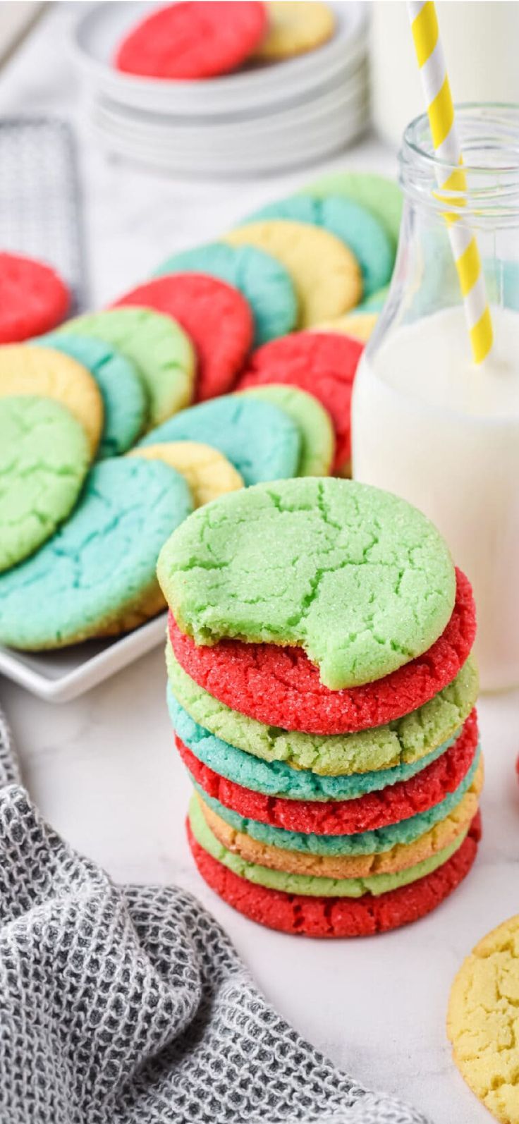 colorful cookies and milk on a table