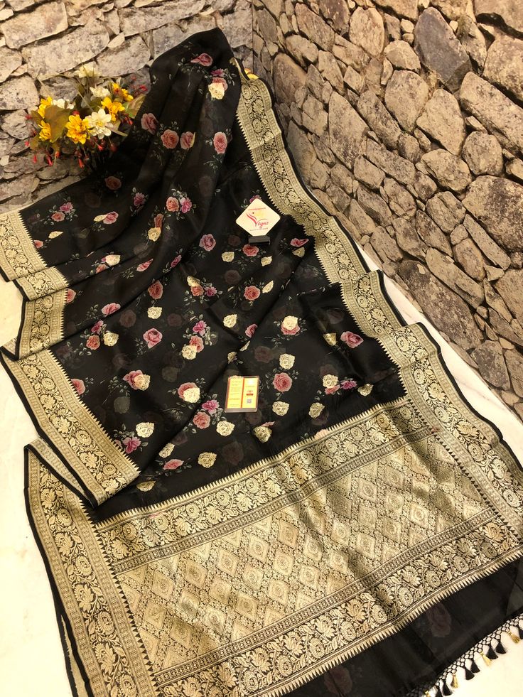 With detailed digital print work done with intricate detail makes this designer collection one of the sorted and unique buys to try for any light occasion or party in a great onyx black color. It is beautifully paired with woven zari work on the border and the pallu and mandala butta work on the body makes this saree unique. Color: A shade of onyx black color Technique: Amazing work of traditional zari weaving on the whole saree with digital floral print work on the body Fabric: Organza Quality: Organza Banarasi Saree, Organza Silk Saree, Work Online, Color Techniques, Contrast Blouse, Latest Sarees, Zari Work, Banarasi Saree, Organza Saree