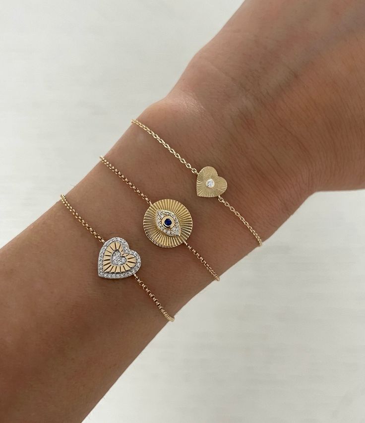 This beautiful bracelet features 1 fluted heart with a diamond center stone. Looks great alone or stacked with other bracelets! Available in 14K Yellow, White or Rose Gold Heart measurement: 7mm Diamond: 0.15tcw Back of heart is fluted too (no diamond) FINAL SALE Diamond Heart Bracelet With Accents, Diamond Heart Bracelet With Diamond Accents, Heart Shaped Diamond Bracelet With Accents, Fine Jewelry Heart Bracelet With Diamond Accents, Diamond Heart Charm Bracelet Jewelry, Heart-shaped Fine Jewelry Bracelet With Diamond Accents, Diamond Heart Charm Bracelet In White Gold, White Gold Diamond Heart Bracelet With Heart Charm, Luxury Adjustable Heart Bracelet