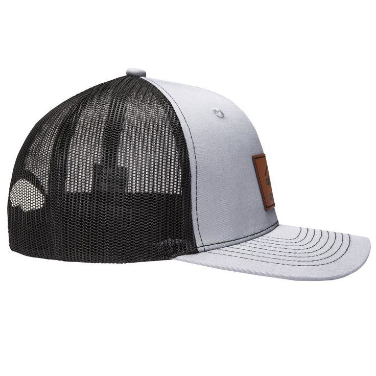 a white and black trucker hat with brown leather patch