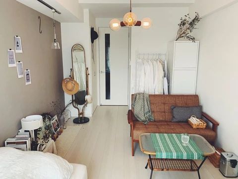 a living room filled with furniture and lots of clutter