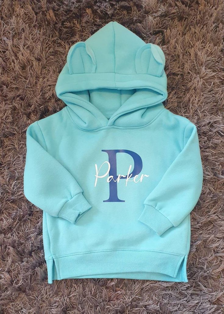 THIS LISTING IS FOR A BLUE HOODIE. PLEASE SEE OTHER MY LISTINGS FOR OTHER COLOURS All items shipped from Ireland Beautiful Thick Hoodie, comes in either Bear or Dinosaur, please specify in the personalisation section which you would like along with the name and what colour initial and text. Glitter text only available in pink and white - any other colours will be plain not glitter. Please note all items are sent standard post not tracked therefore you will not receive a tracking number unless yo Cute Blue Crew Neck Hoodie, Blue Hooded Top With Letter Print, Casual Blue Sweatshirt With Name Print, Cute Blue Fleece Hoodie, Blue Fleece Tops With Letter Print, Blue Long Sleeve Top With Name Print, Cute Blue Hooded Hoodie, Cute Blue Tops With Drawstring Hood, Cotton Hooded Sweatshirt With Name Print