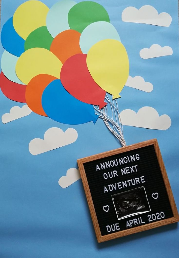 a bunch of balloons that are in the air with a sign on it saying, announcing our next adventure due april