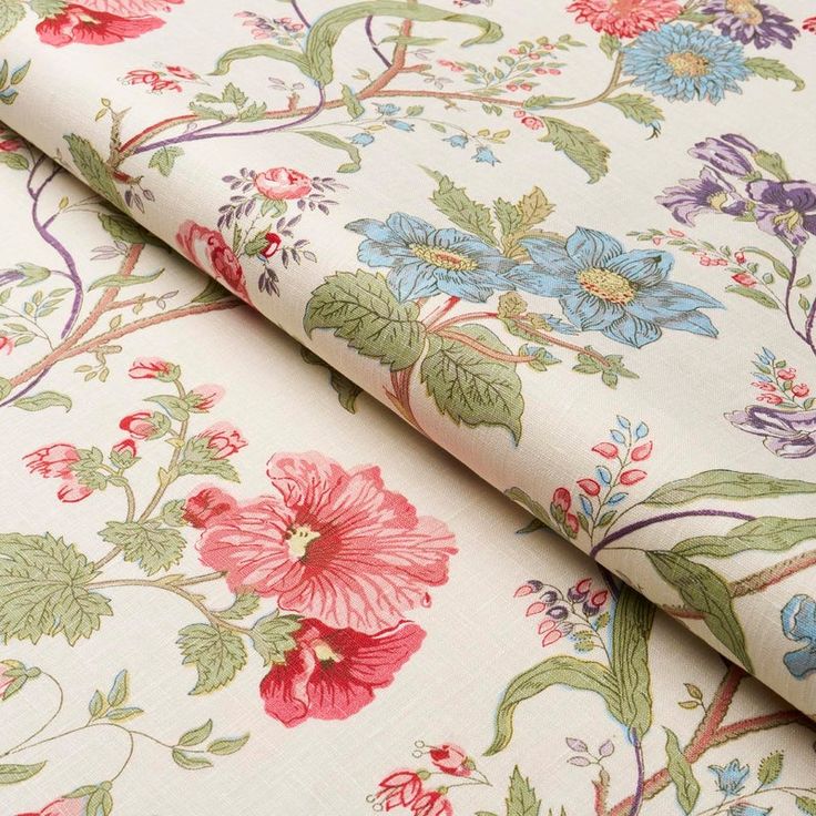 an image of a flowered fabric with many flowers on it's side and the background