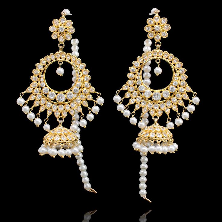 A jewelry collection must-have that you’ll wear for years to come no matter what’s trending! The look includes an exquisite teekah beautifully detailed with kundan stones and pearl moti with a pair of matching earrings . Gold-plated on high-quality brass as base metal. Made by order. Kindly allow 4-6 weeks for the delivery of this item. For custom or urgent requests, please contact support@alacouture.com. *Please Note: We use faux stones and beads in all of our jewelry. Bollywood Style Pearl Bridal Earrings For Festive Occasions, Festive Chandbali Bridal Earrings With Pearls, Festive Pearl Chandbali Bridal Earrings, Festive Pearl Chandbalis, Festive Bridal Pearl Earrings With Meenakari, Bollywood Pearl Chandbali Jhumkas, Bollywood Chandbali Pearl Bridal Earrings, Festive Pearl Jhumkas, Elegant Pearl Chandbali Bridal Earrings With Tilla