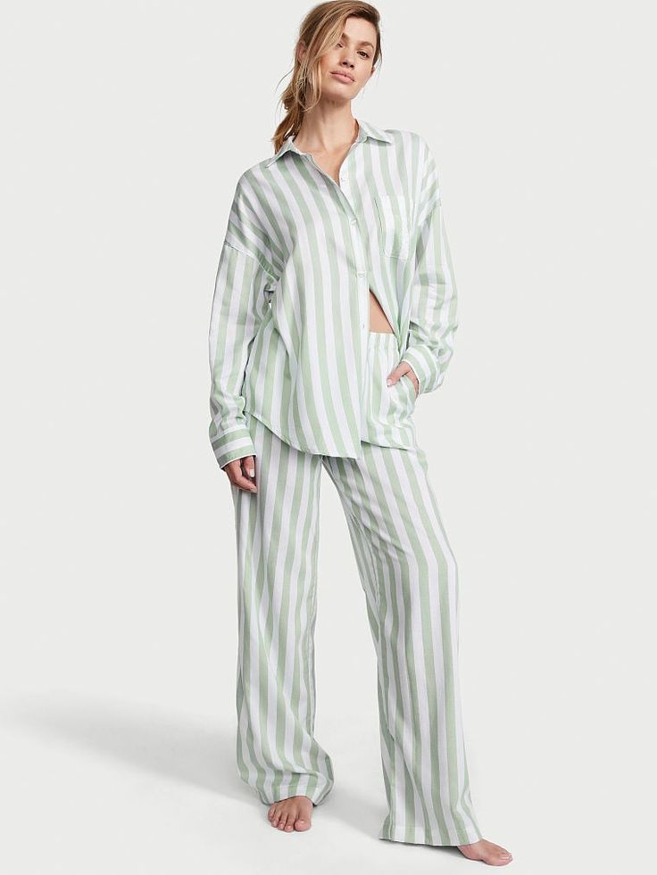 Crafted in an ultra-soft modal-cotton blend, these classic PJs are what dreams are made of. Oversized fit Long sleeve, button-front top hits at hips Chest pocket Pants with elastic waist Soft, plant-derived modal fibers, sourced from sustainably managed forests Machine wash Imported Long Pyjamas, Lingerie Catalog, Bridesmaid Pyjamas, Victoria Secret Pajamas, Pajamas Gift, Pajamas Sets, Cami Set, Striped Pyjamas, Victoria Secret Lingerie