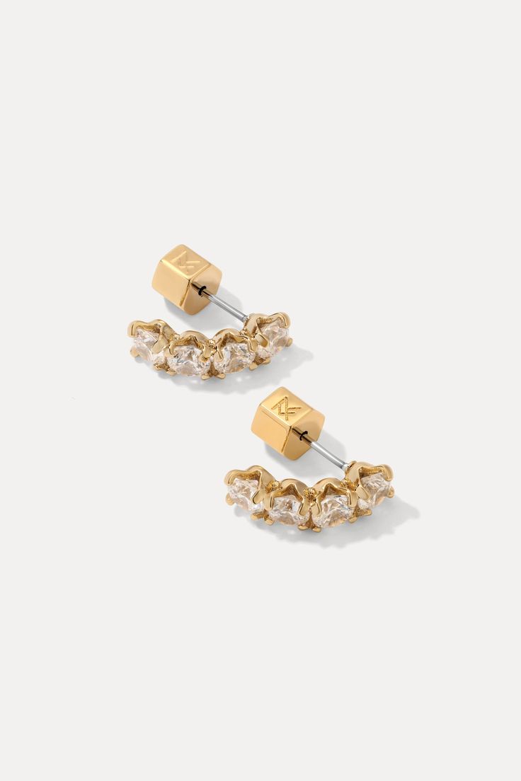 Drop everything and scoop up the Ansley Studs. Drop stud earrings adorned with luxurious cubic zirconia, the Ansleys are perfect to add glamour for the day or a more minimal sparkle at night. Your earring game covered! STYLING TIP: Pair these studs with the best selling Shea Necklace for a sleek and refined look. 18k gold-plated brass 4mm cubic zirconias 1 ½ cm drop Includes earring backs "I’ve had these earrings for a little while and I always get so many compliments each time I wear them. I lo Gold Cubic Zirconia Ear Cuff For Party, Gold Cubic Zirconia Ear Climbers For Formal Events, Gold Cubic Zirconia Ear Climbers For Formal Occasions, Gold Cubic Zirconia Ear Climbers With Prong Setting, Formal Gold Cubic Zirconia Ear Climbers, Glamorous Gold Earrings With Prong Setting, Fashion Jackson, Virtual Fashion, Earring Backs