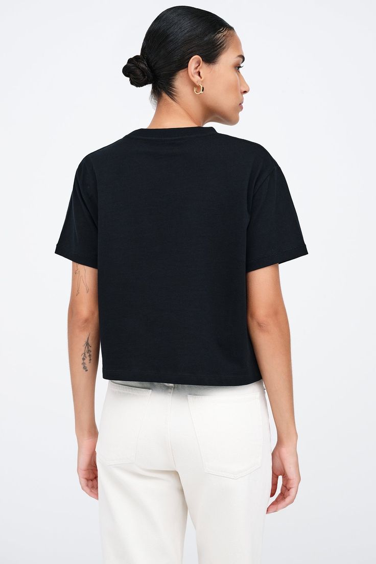 Our Rya Tee is for those who expect their basics to go above and beyond. Fashioned from French organic cotton jersey, she offers unrivaled softness and breathability in a cropped, oversized cut. With short sleeves and a rib-knit crew neck for visual interest, this classic tee works solo or as a base to create countless unique looks.[SPLIT] Astrid, in black, is 5'9" (175 cm) tall, wearing size XS. Rocio, in white, is 5'9.5" (175 cm) tall, wearing size XS. Total length is approximately 20" (51 cm) Boxy Short Sleeve Basic Cropped T-shirt, Relaxed Fit Cropped T-shirt For Everyday, Boxy Cropped T-shirt For Streetwear, Casual Boxy Fit Cropped T-shirt With Short Sleeves, Boxy Cropped Cotton T-shirt For Streetwear, Boxy Cropped T-shirt For Summer Streetwear, Summer Boxy Cropped T-shirt For Streetwear, Basic Crew Neck Crop Top With Relaxed Fit, Boxy Cotton Cropped Shirt For Everyday