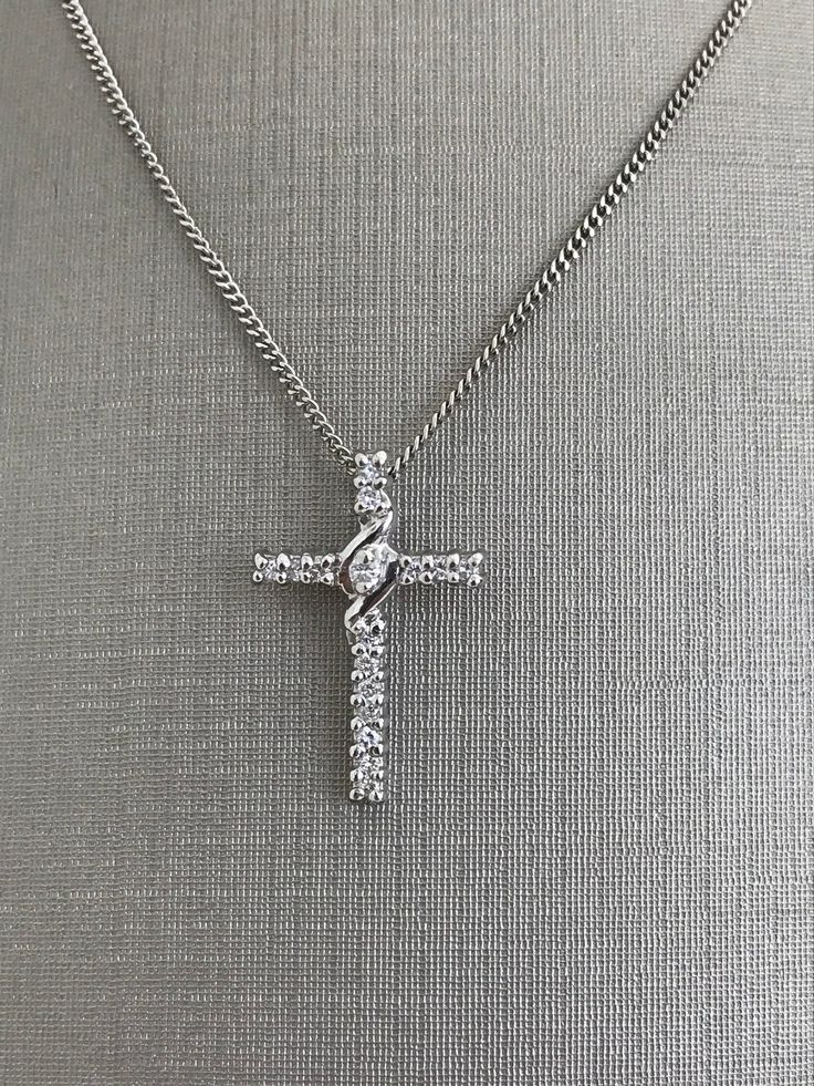 14 Karat White Gold Medium Size Cross with Diamonds and Chain For Her 18 inch chain length 2.8 grams Cheap White Cross Jewelry, Luxury White Cross Necklace Elegant Style, Luxury Classic Diamond White Cross Necklace, Luxury Brilliant Cut Diamond White Cross Necklace, Elegant Cross Chain Necklace With Adjustable Chain, White Gold Necklace With Cross Pendant, Elegant Silver Cross Necklace With Chain, Elegant Cross Pendant Necklace With Silver Chain, Elegant Silver Chain Cross Necklace