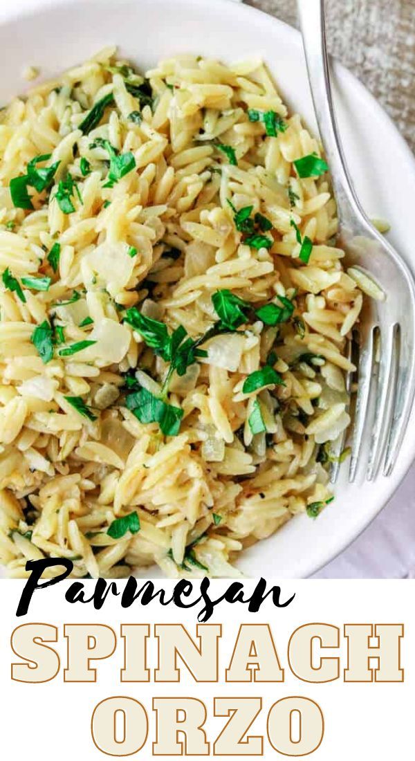 parmesan spinach orzo in a white bowl with a fork