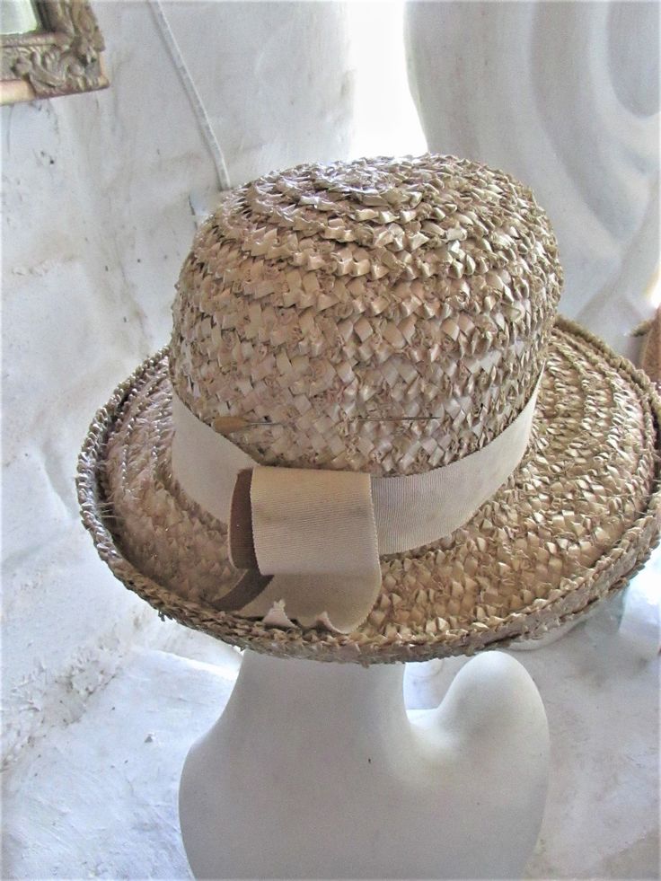 "STYLISH BEIGE 60's SUN HAT This stylish hat is a fashion statement that would work for any era--a good choice for an afternoon garden party, wedding or day at the races...or a stroll down the sidewalk! It is well made despite no maker's label, in a color that will go with almost anything. It has a hatband of beige with a 2 tone grosgrain ribbon in brown and beige at the back and would be ideal for brown spectator pumps. A vintage treasure to last another lifetime or 2! Very good to excellent co Vintage Cream Mini Hats With Curved Brim, Vintage Cream Mini Hat With Curved Brim, Vintage Cream Cloche Hat With Curved Brim, Vintage Adjustable Cream Cloche Hat, Vintage Cream Adjustable Cloche Hat, Adjustable Vintage Cream Cloche Hat, Cream Cloche Hat For Summer Church Events, Summer Cream Cloche Hat For Church, Vintage Cream Brimmed Mini Hat