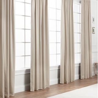 the curtains are open and ready to be hung in front of the window with wood flooring