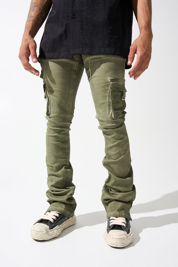 SERENEDE® "OIL" cargo stacked jeans feature our signature stretch material for a comfortable feel. Olive wash* with a slight tint of green. SERENEDE® signature skinny fit construction with a stacked ankle. This unique style features multiple cargo pockets. Designed to be individually unique. DETAILED FEATURES: OLIVE wash [ slight tint of green ] Cargo pockets Stacked finish Fading throughout Signature "leather" waistband label SERENEDE® branded hardware Five-pocket styling Zipper fly 5.5" W Ankl Fitted Urban Cargo Jeans With Cargo Pockets, Military Style Jeans With Side Pockets For Streetwear, Fitted Washed Cargo Jeans For Streetwear, Fitted Urban Cargo Jeans, Fitted Cargo Style Jeans For Streetwear, Military Cargo Style Jeans For Streetwear, Military Style Green Cotton Jeans, Military Green Cotton Jeans, Green Military Style Cotton Jeans