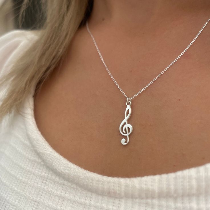 Musical Note Necklace, Design Musical Note Necklace, Necklace For Music Lovers, Silver Treble Clef Necklace, Elegant Music Note Necklace, Gift for Her Introducing our exquisite Note Necklace, a charming accessory that will add a touch of elegance to any outfit. This necklace is the perfect blend of simplicity and sophistication, featuring a delicate pendant in the shape of a musical note. Crafted with attention to detail, it showcases a sleek and polished design that effortlessly catches the eye Music Note Pendant, Nickel-free Sterling Silver Music-themed Necklace, Music-themed Silver Pendant Necklace, Music-themed Sterling Silver Pendant Necklace, Sterling Silver Music-themed Pendant Necklace, Music-themed Pendant Necklaces As Gift, Music-themed Pendant Necklace As Gift, Music-themed Pendant Necklace, Flute Necklace