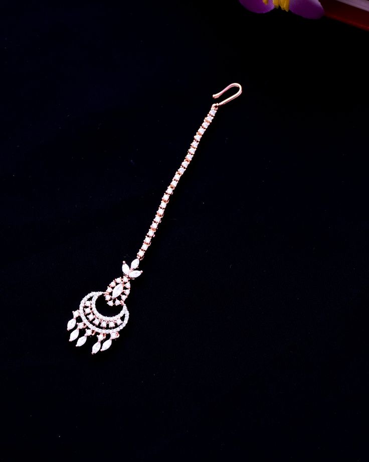 This is a beautiful Mangtikka, made with American Diamond. This work well with all types of clothing, whether it be formal attire or a casual party. Eye-catching and unique jewellery that will set you apart. Gift this piece to a loved one, and see their face light up with joy. Best for gifting or for personal use, wear it to any occasion and be in the spotlight. Temple Jewelry Style Tikka For Eid Celebration, Temple Jewelry Tikka For Eid Celebration, Eid Celebration Temple Jewelry Tikka, Elegant Hand Set Tikka For Festive Occasions, Elegant Ceremonial Tikka With Tilla Detailing, Elegant Silver Traditional Wear For Party, Eid Festive Tikka With Tilla Detail, Elegant Cutdana Tikka For Festivals, Tilla Tikka For Eid Festivities