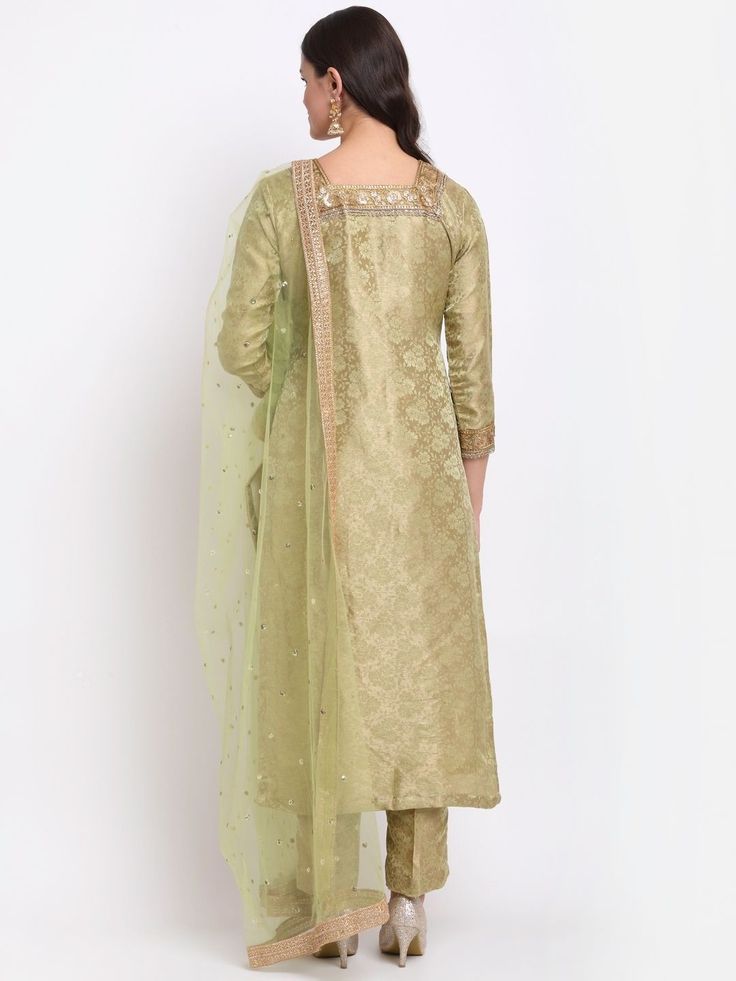 Green Palazzo Suit Set with Dupatta in which the Kurta is fabricated in brocade fabric detailed with print work, straight cut, 3/4th sleeves, square neck teamed with straight printed palazzo pants and a dupatta to match. Kurta Length-46 inches Top Fabric-Brocade Bottom Fabric-Brocade Dupatta-Silk Washing Care-Dry Clean Ships within 3-4 weeks Brocade Dupatta, Kurta And Palazzo, Pista Green, Printed Palazzo Pants, Palazzo Suit, Brocade Fabric, Suit Set, Top Fabric, Palazzo Pants