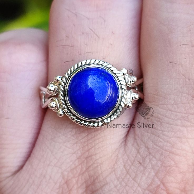 Spark your little one's imagination with this enchanting Natural Lapis Lazuli Round 925 Sterling Silver Handmade Statement Ring! This adorable ring features a stunning 9.0mm round Lapis Lazuli gemstone, known for its rich, celestial blue hues and sparkling pyrite flecks. Set in a delicate yet sturdy 925 sterling silver band, it's perfect for everyday wear or adding a touch of magic to special occasions. Here's why this ring is the perfect gift for your little princess: Gemstone Power: Lapis Lazu Handmade Sterling Silver Birthstone Ring Gift, Sterling Silver Nickel-free Birthstone Ring For Gift, Nickel-free Sterling Silver Birthstone Ring For Gift, Sapphire Moonstone Ring In Sterling Silver As Gift, Blue Moonstone Sterling Silver Ring Gift, Blue Moonstone Ring In Sterling Silver As Gift, Sapphire Sterling Silver Rings Gift, Sterling Silver Ring With Bezel Setting Gift, Spiritual Adjustable Sterling Silver Birthstone Ring