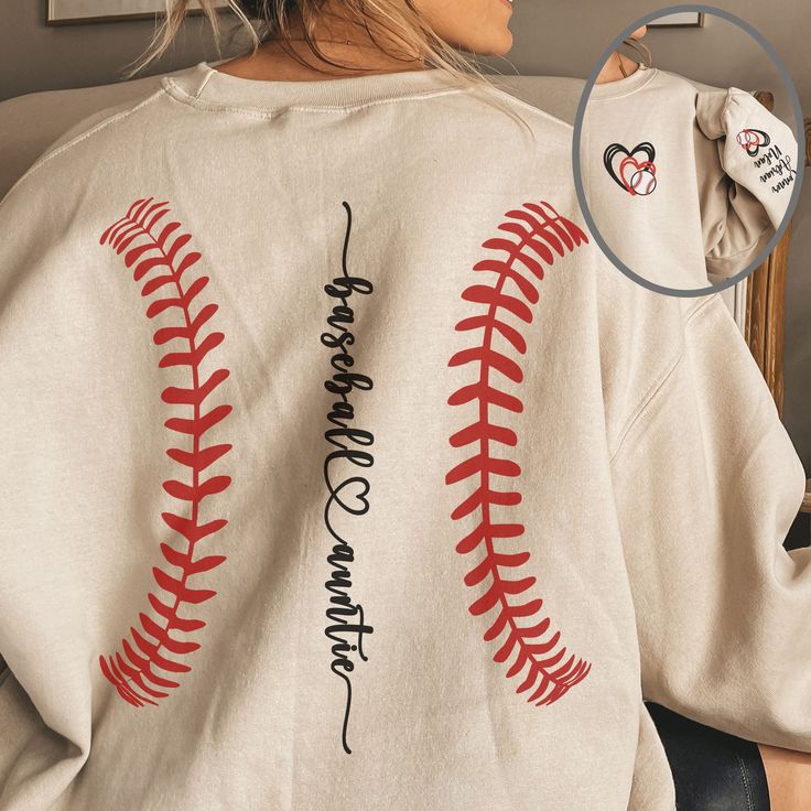 a woman sitting in a chair wearing a baseball shirt with the words love and softball written on it