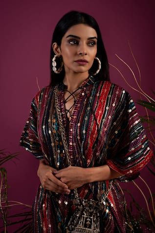 Multicolour kaftan style dress with sequin embroidery on a stripe print base.
Components: 1
Pattern: Embroidered
Type Of Work: Sequin
Neckline: V-neck
Sleeve Type: Flared
Color: Multi Color
Other Details: 
Attached lining
Weight: Approx 500 grms
Note: Bag worn by the model is not for sale
Occasion: Sangeet,Mehendi and Haldi - Aza Fashions Kaftan Style Dresses, Kaftan Women, Kaftan For Women, Kaftan Style, Sequin Embroidery, Sequins Embroidery, Color Stripes, Aza Fashion, Style Dress