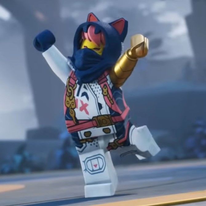 the lego character is wearing a costume and holding his arms in the air with one hand