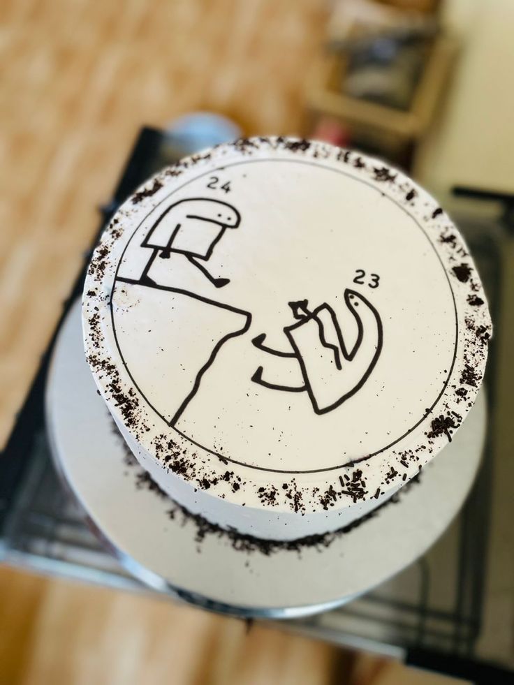 a white cake with black writing on it