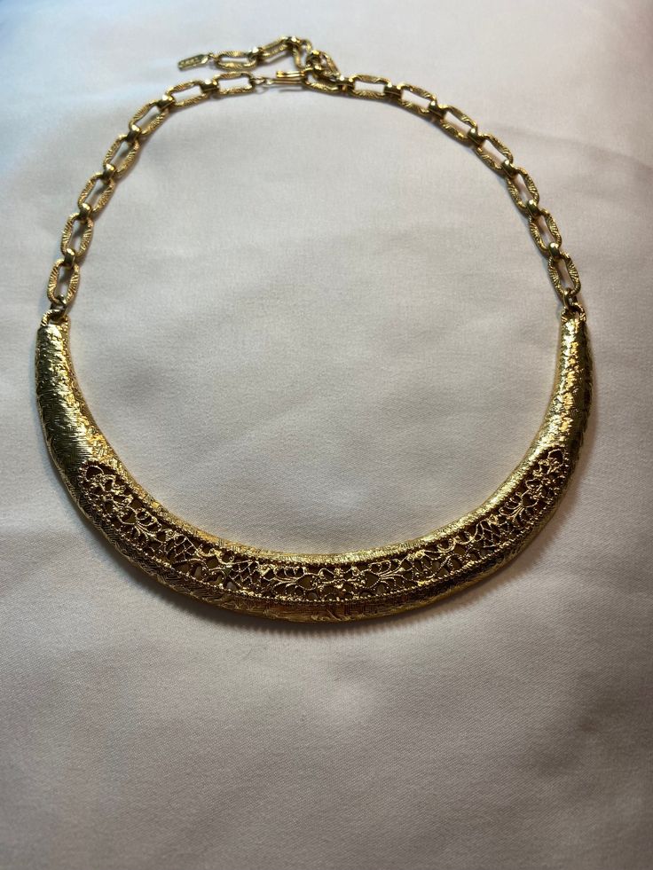 Vintage, gold tone, filagree necklace, adjustable hook clasp, 10-17 inches, excellent preowned condition. Vintage Gold Necklace With Intricate Design, Vintage Gold Choker For Formal Occasions, Vintage Gold Filigree Necklace, Antique Gold Metal Necklace With Filigree, Gold Filigree Costume Jewelry Necklace, Gold Necklaces With Intricate Metal Design, Evening Gold Filigree Jewelry, Formal Choker Necklace With Intricate Design, Vintage Choker Necklace With Intricate Design