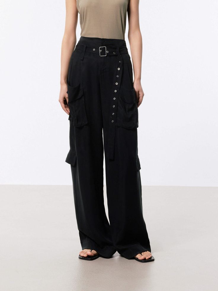 MO&Co. Women's Wide Leg Cargo Pants These pants are made from sustainable and eco-friendly materials, featuring a wide-leg and cargo style making them a fashionable and practical choice for a casual or streetwear look. The wide pocket design adds functionality and versatility, perfect for carrying essentials while on the go, and the belt ensures a secure fit and adds an extra touch of style. The brown pants may appear olive or khaki under different lighting. Features : - Wide leg in cargo style, Wide Leg Cargo Pants, Cargo Style, Brown Pants, Pocket Design, Cargo Pants, Black Pants, Carry On, Wide Leg, Eco Friendly