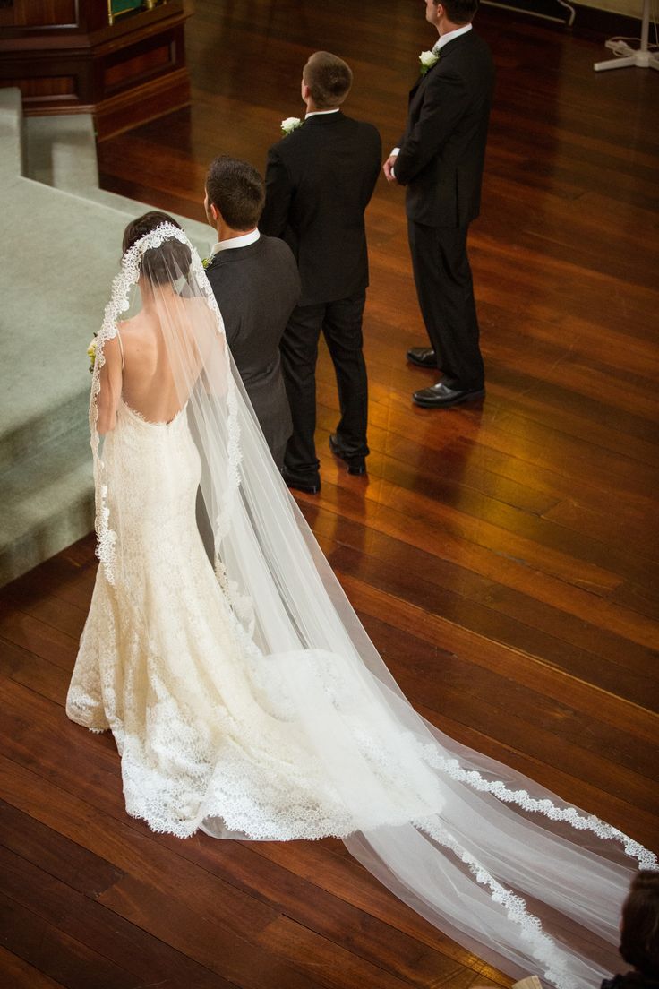 the bride and groom are getting ready to walk down the aisle