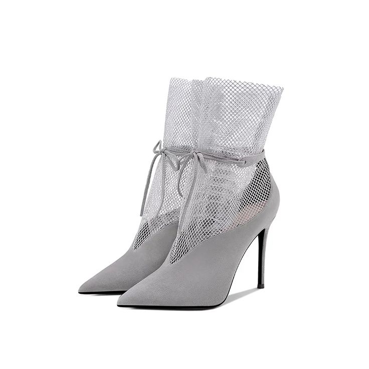 Elevate your style with our Grey Vegan Suede Net Patchwork Lace-up Heeled Ankle Boots. These chic boots feature a unique patchwork design, perfect for adding a touch of sophistication to any outfit. Color: Grey Material: Vegan suede and net Heel Type: Stiletto heel Heel height: 4.72" / 120 mm approx Product measurements were taken using size 8. Please note that measurements may vary by size. Toe: Pointed toe Ankle lace-up design. Handcrafted US sizing. Fits true to size. Elegant Gray Winter Boots, Gray High Heel Party Boots, Gray High Heel Boots For Party, Chic Gray Winter Boots, Gray High Heel Winter Boots, Trendy Gray Pointed Toe Boots, Chic Gray Pointed Toe Boots, Gray Lace-up Boots For Spring, Gray High Heel Boots For Spring