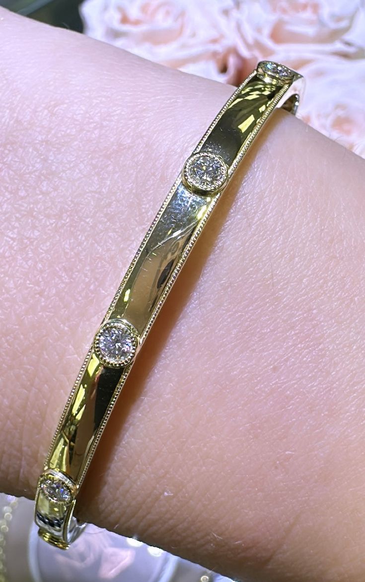 This best-selling style boasts a polished gold finished inlaid with 5 sparkling round-cut diamonds. An instant classic that will become your signature. Metal: 18K Yellow GoldDiamond Weight: 0.45ct t.w.Diamond Shape: 5 Round Brilliant cutsSetting: Burnish / Inlay Bangle Width: 48 X 58mm Luxury Diamond White Diamond Bracelet For Anniversary, Luxury Diamond White Bracelet For Anniversary, Classic White Gold Bangle With Single Diamond, Classic Channel Set Diamond Bracelet, Elegant Gold Diamond Bracelet With Polished Finish, Elegant Gold Bracelet With Diamond And Polished Finish, Classic Yellow Gold Bracelet With Single Diamond, Luxury Yellow Gold Diamond Bracelet With Single Diamond, Luxury Diamond Tennis Bracelet With Channel Set