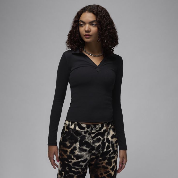 Soft, stretchy and oh-so comfortable. Made for everyday wear, this ribbed long-sleeve top gives you a confident, casual look with a body-skimming fit and V-neck design. High Stretch Casual Long Sleeve Top For Layering, Versatile Long Sleeve Ribbed Top, Fitted V-neck Top With Ribbed Cuffs, Winter Long Sleeve Elastane Top, Trendy Elastane Long Sleeve Top For Fall, Black Ribbed Long Sleeve Top For Winter, Trendy Fall Long Sleeve Top In Elastane, Casual High Stretch Tops With Ribbed Cuffs, Casual Ribbed Stretch Long Sleeve Top