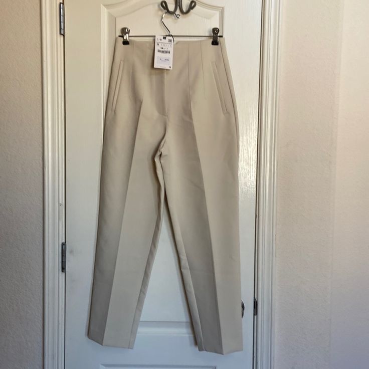 Nwt, Small, Beige Zara Classic Style Pants. Bit Small For Me On Waistline As I’m 126 Lb. Cream Business Casual Trousers, Cream Tapered Leg Bottoms For Workwear, Cream Ankle-length Workwear Bottoms, Neutral Pants For Spring Workwear, Cream Ankle-length Pants For Workwear, Cream Ankle-length Pants For Business Casual, Neutral Spring Workwear Pants, Ankle-length Cream Bottoms For Workwear, Cream Straight Pants For Work